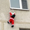 Funny Santa on the wall of a house